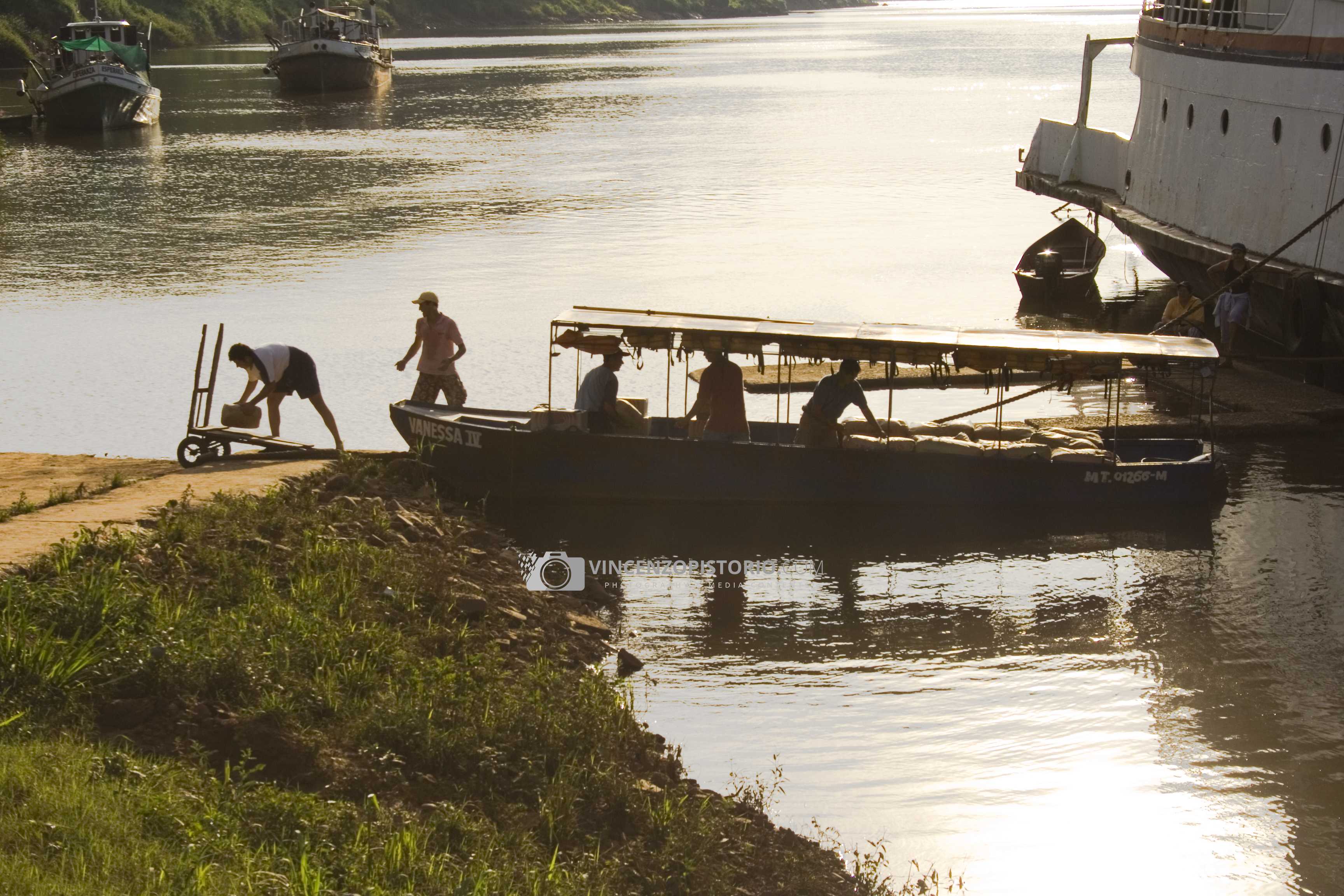 Dockers working at sunset